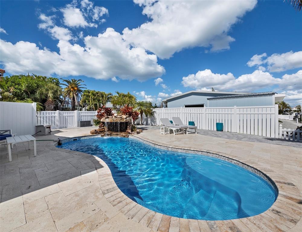 726 Jungle Queen Way Longboat Key, FL 34228 - Photo 29 of 43 a view of a house with swimming pool and sitting area