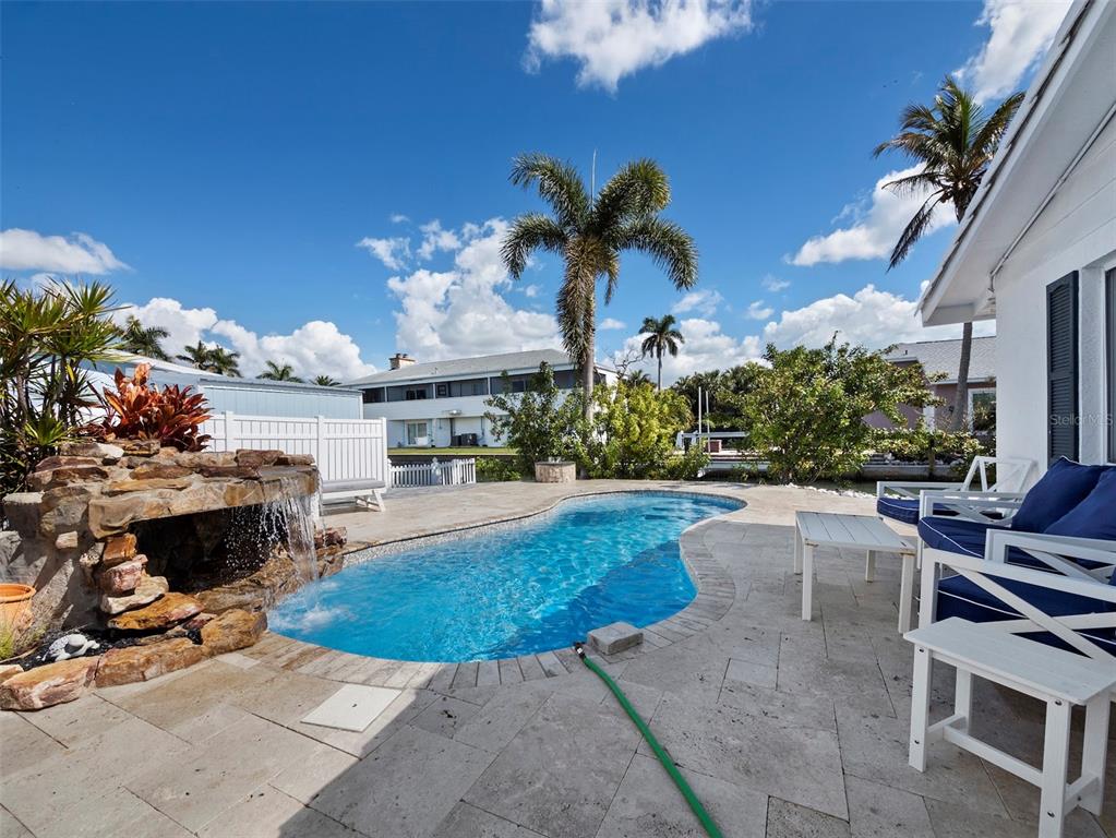 726 Jungle Queen Way Longboat Key, FL 34228 - Photo 31 of 43 a view of a swimming pool with outdoor seating