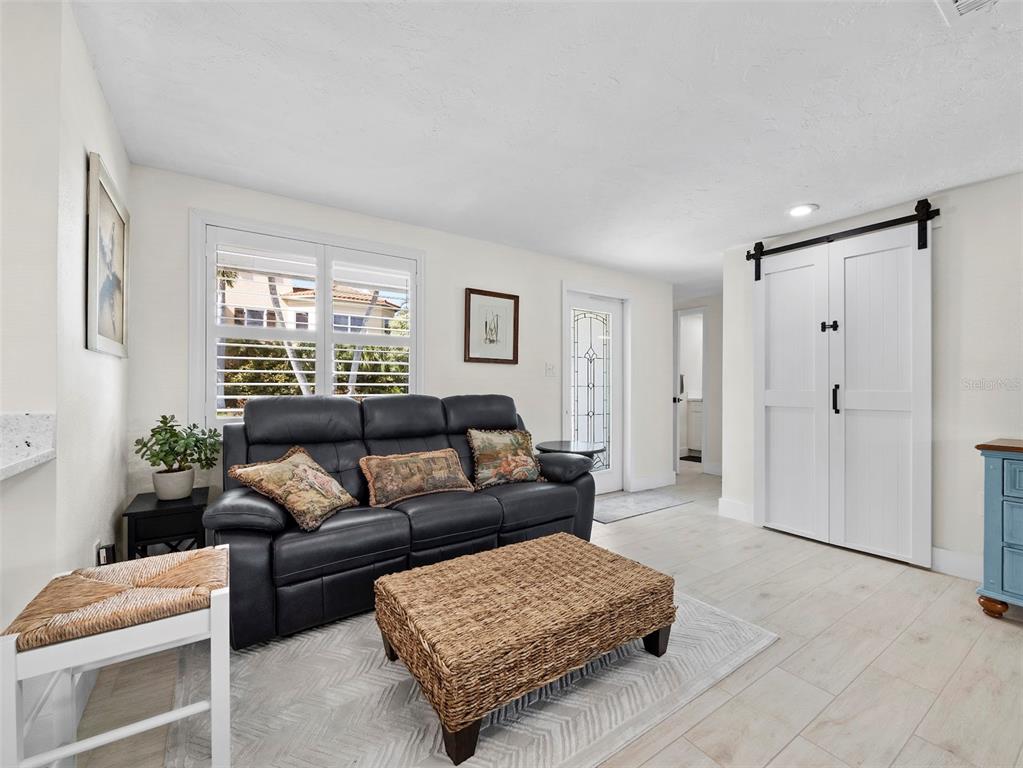 726 Jungle Queen Way Longboat Key, FL 34228 - Photo 6 of 43 a living room with furniture and a window