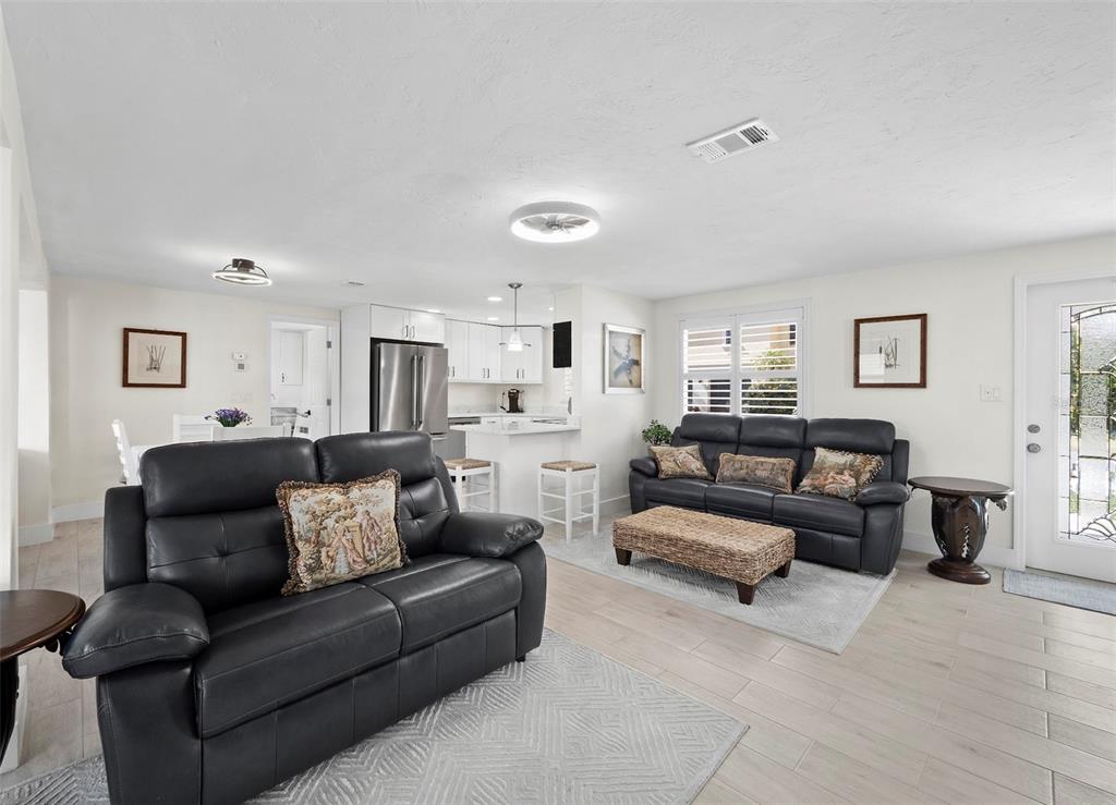 726 Jungle Queen Way Longboat Key, FL 34228 - Photo 7 of 43 a living room with furniture and a couch