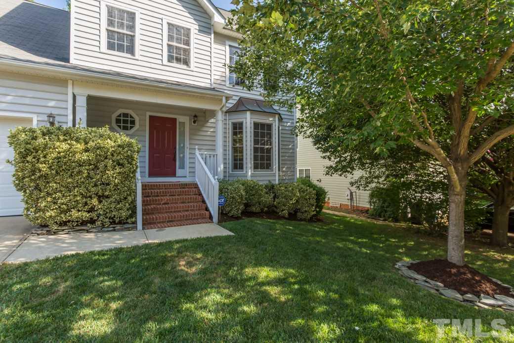 8620 Erinsbrook Drive Raleigh, NC 27617 - Photo 1 of 25 a front view of a house with a yard
