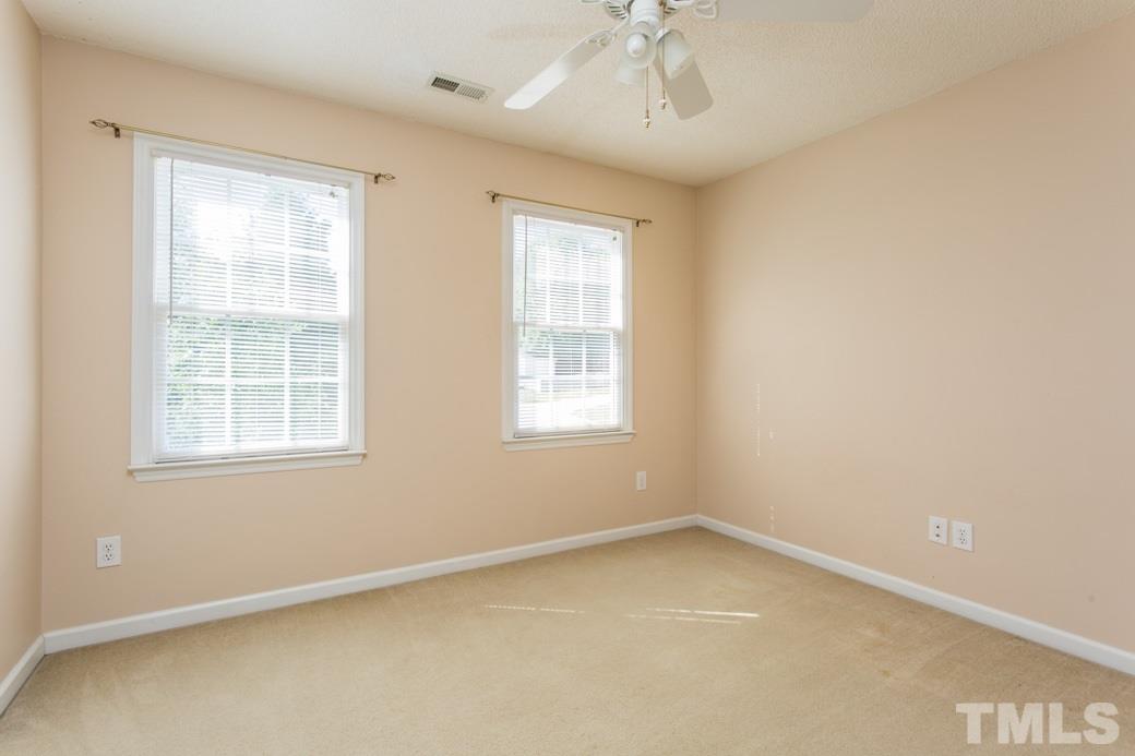 8620 Erinsbrook Drive Raleigh, NC 27617 - Photo 11 of 25 an empty room with a window