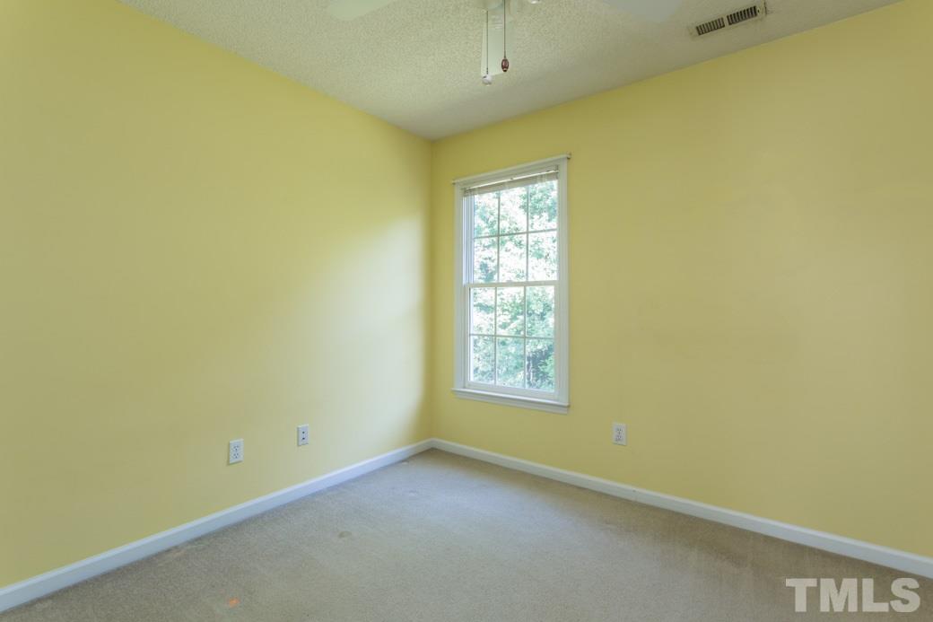 8620 Erinsbrook Drive Raleigh, NC 27617 - Photo 13 of 25 an empty room with windows