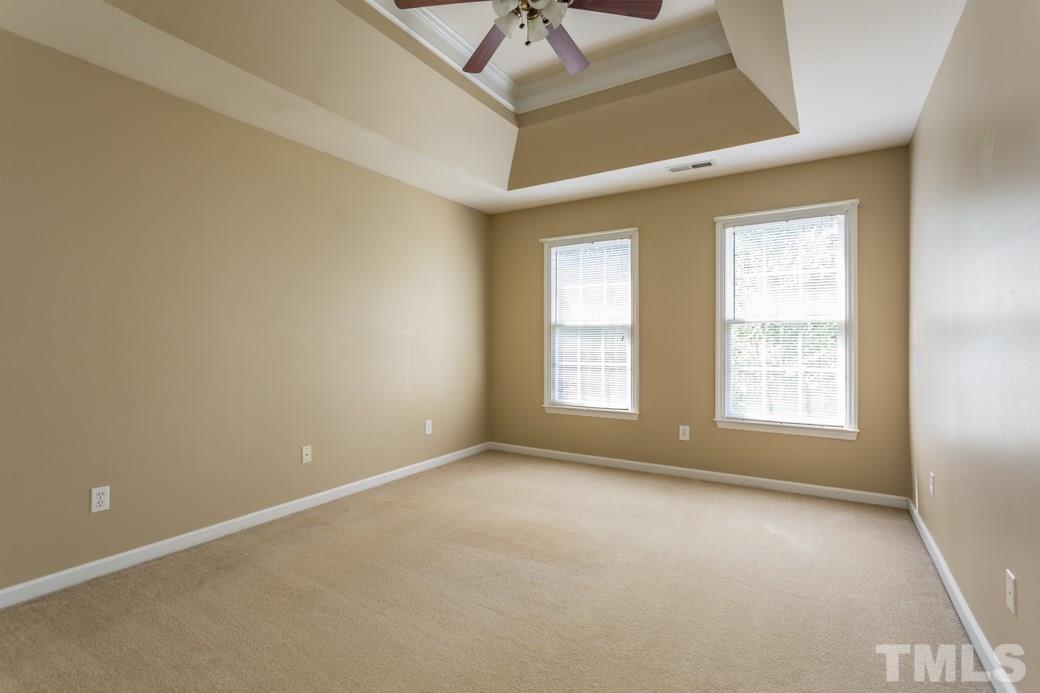 8620 Erinsbrook Drive Raleigh, NC 27617 - Photo 14 of 25 an empty room with a window