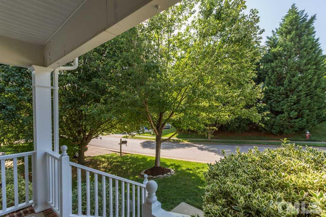 8620 Erinsbrook Drive Raleigh, NC 27617 - Photo 3 of 25 a view of a patio with table and chairs plants and large trees