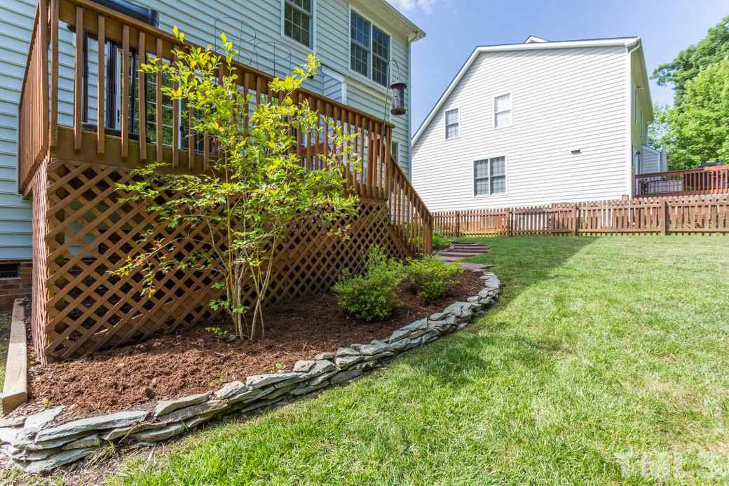 8620 Erinsbrook Drive Raleigh, NC 27617 - Photo 21 of 25 a view of a back yard of the house
