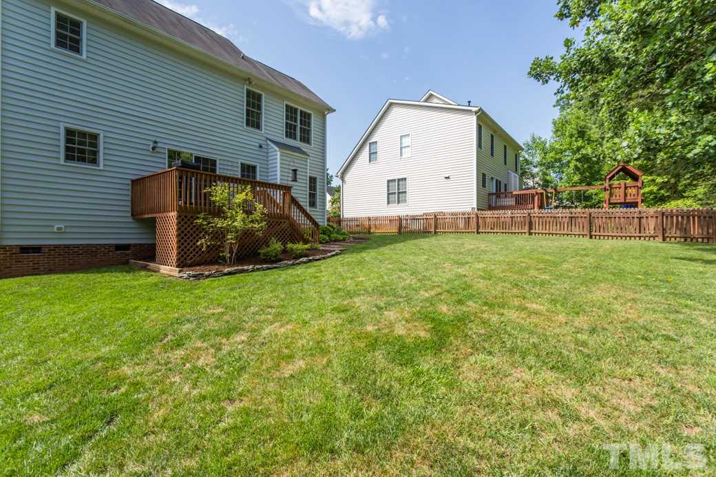 8620 Erinsbrook Drive Raleigh, NC 27617 - Photo 25 of 25 a view of a back yard of the house