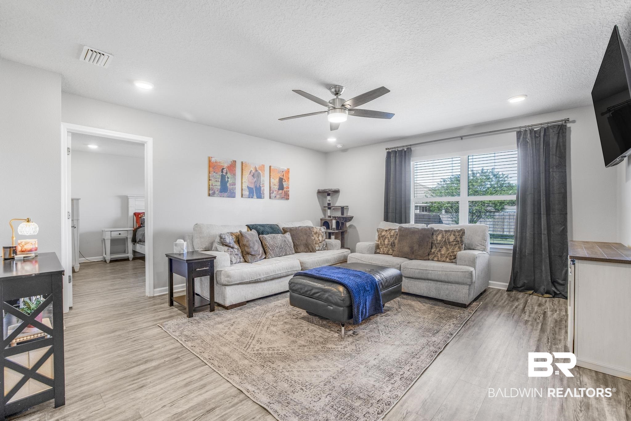 10738 Ridgeview Drive Mobile, AL 36608 - Photo 12 of 48 Living area featuring light wood finished floors, recessed lighting, ceiling fan, and a textured ceiling