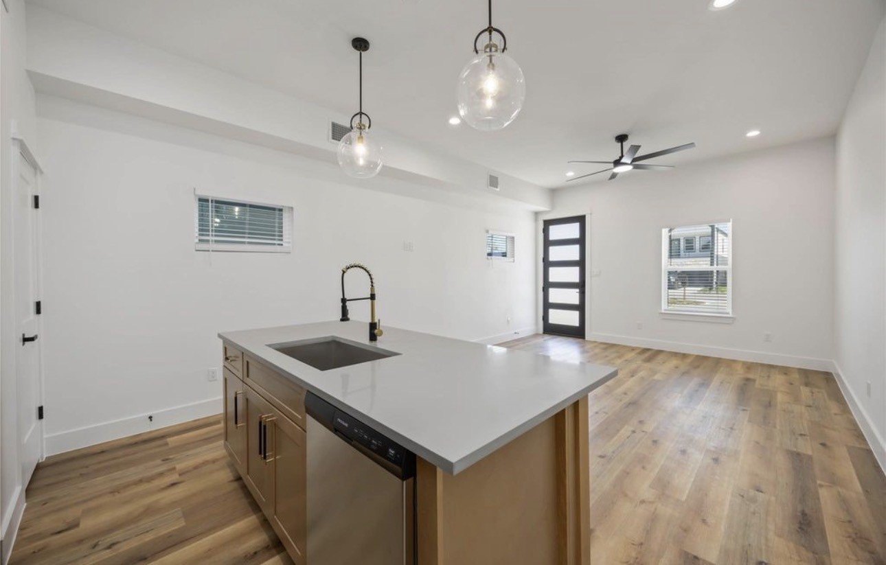 8011 Cora Street, Unit A Houston, TX 77088 - Photo 4 of 14 a kitchen with a sink a counter space and cabinets