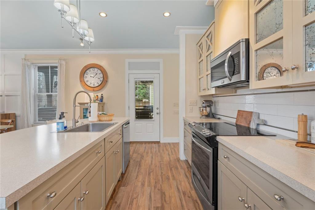 243 Bluegill Road Eatonton, GA 31024 - Photo 13 of 54 a kitchen with a sink and a stove top oven