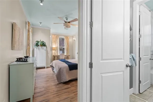 a bathroom with a toilet sink vanity and mirror