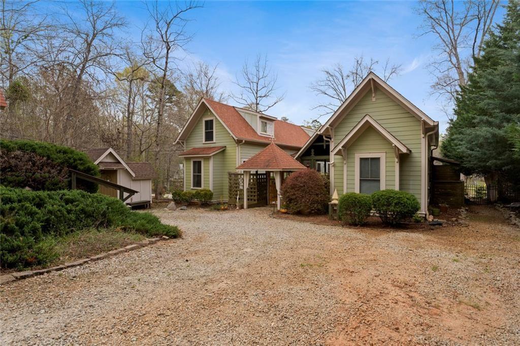 243 Bluegill Road Eatonton, GA 31024 - Photo 2 of 54 a front view of a house with a yard and garage