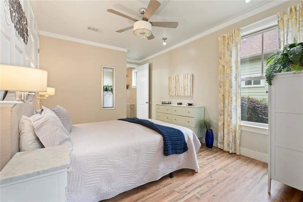 243 Bluegill Road Eatonton, GA 31024 - Photo 22 of 54 a bedroom with a bed and a potted plant