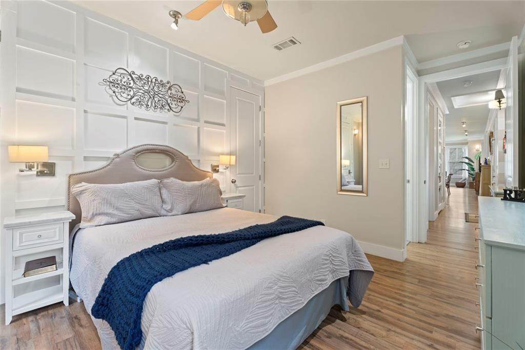 243 Bluegill Road Eatonton, GA 31024 - Photo 23 of 54 a bedroom with a bed and wooden floor