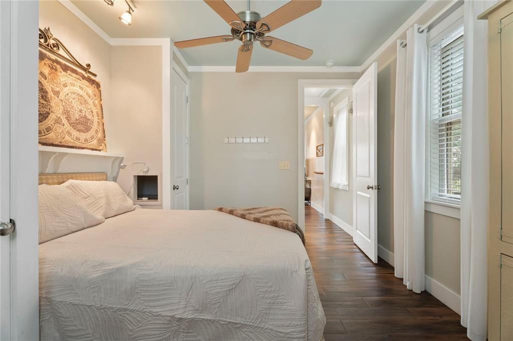 243 Bluegill Road Eatonton, GA 31024 - Photo 24 of 54 a bedroom with a bed and a chandelier