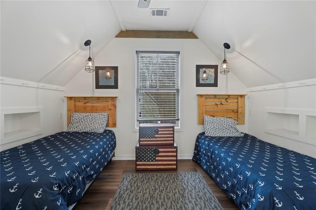 243 Bluegill Road Eatonton, GA 31024 - Photo 30 of 54 a bedroom with a bed and wooden floor