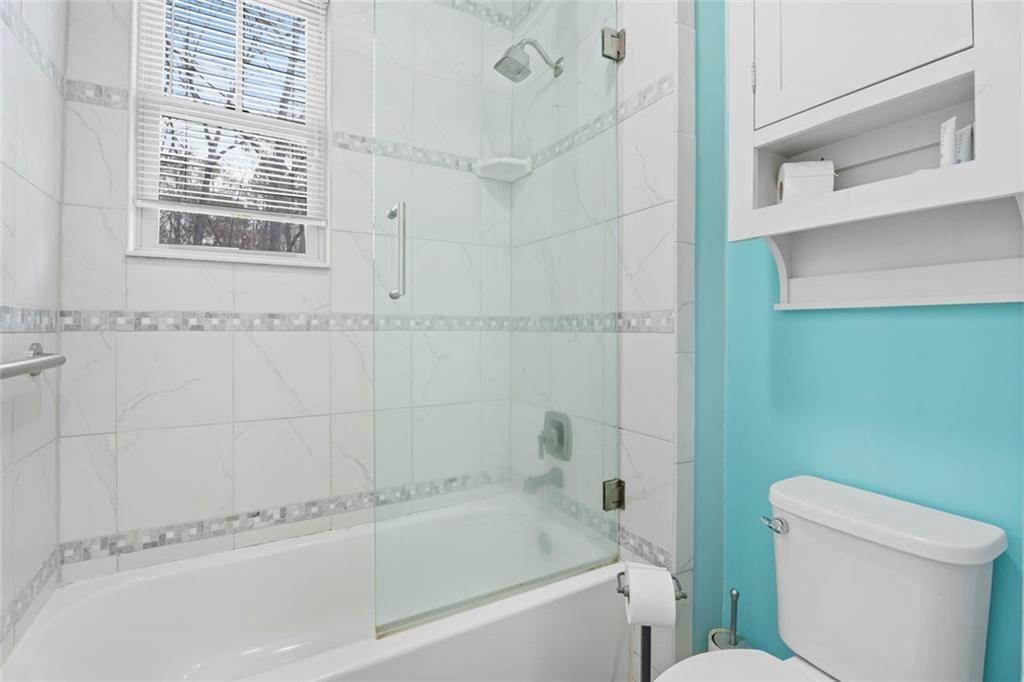 243 Bluegill Road Eatonton, GA 31024 - Photo 33 of 54 a bathroom with a bathtub and a toilet