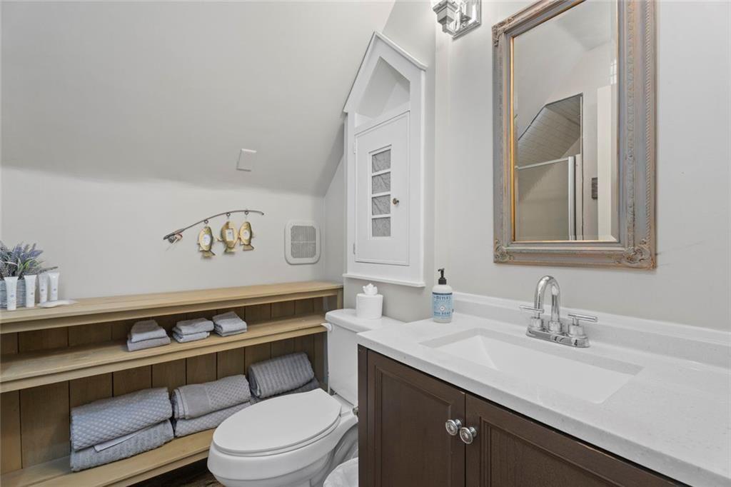 243 Bluegill Road Eatonton, GA 31024 - Photo 34 of 54 a bathroom with a toilet sink and mirror