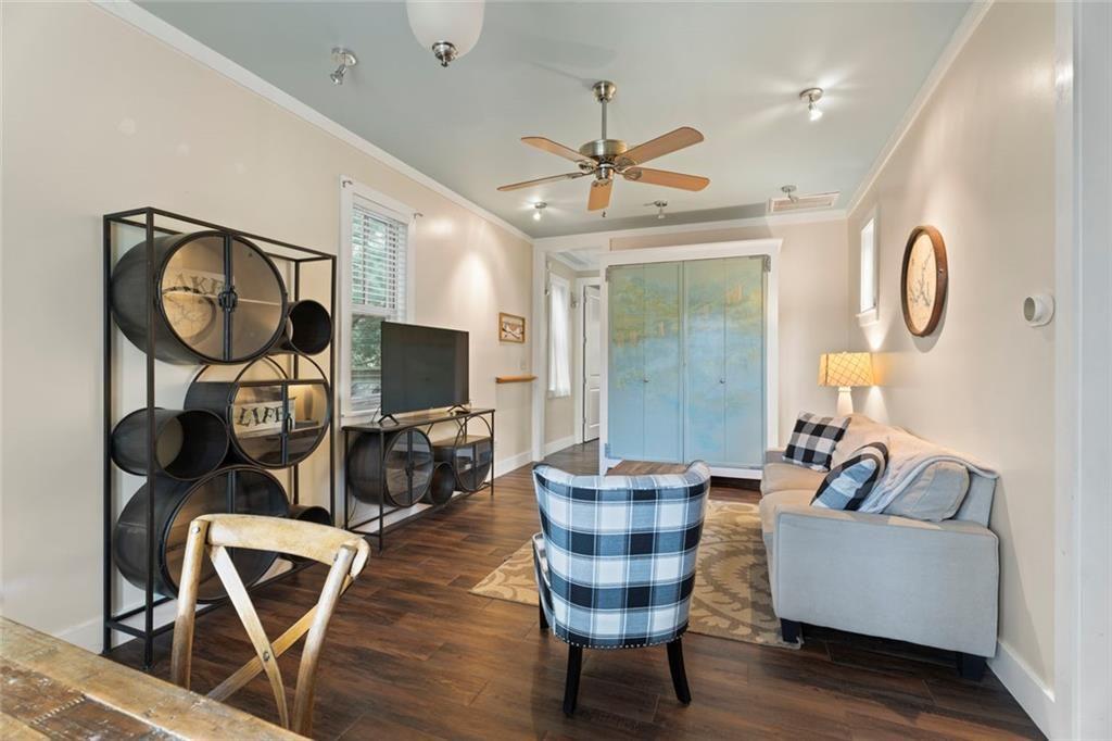 243 Bluegill Road Eatonton, GA 31024 - Photo 38 of 54 a living room with furniture a flat screen tv and wooden floor