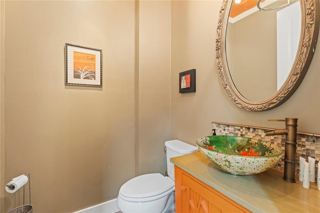 243 Bluegill Road Eatonton, GA 31024 - Photo 46 of 54 a bathroom with a toilet and a mirror