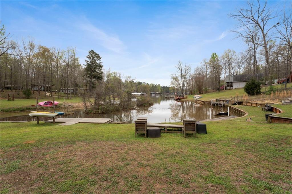 243 Bluegill Road Eatonton, GA 31024 - Photo 54 of 54 a view of a white house with a yard and sitting area
