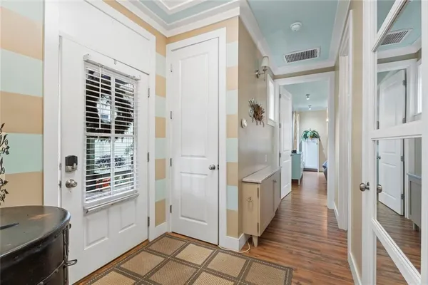 a bedroom with a bed and a potted plant
