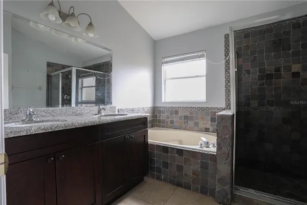 a bathroom with a bathtub and a sink