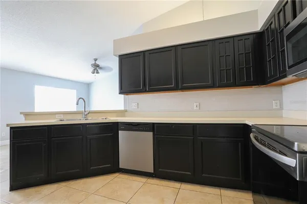 a kitchen with a sink and a stove
