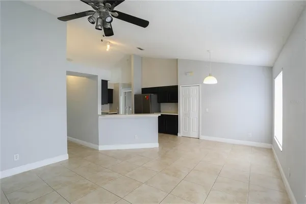 a view of a kitchen with a sink and cabinets