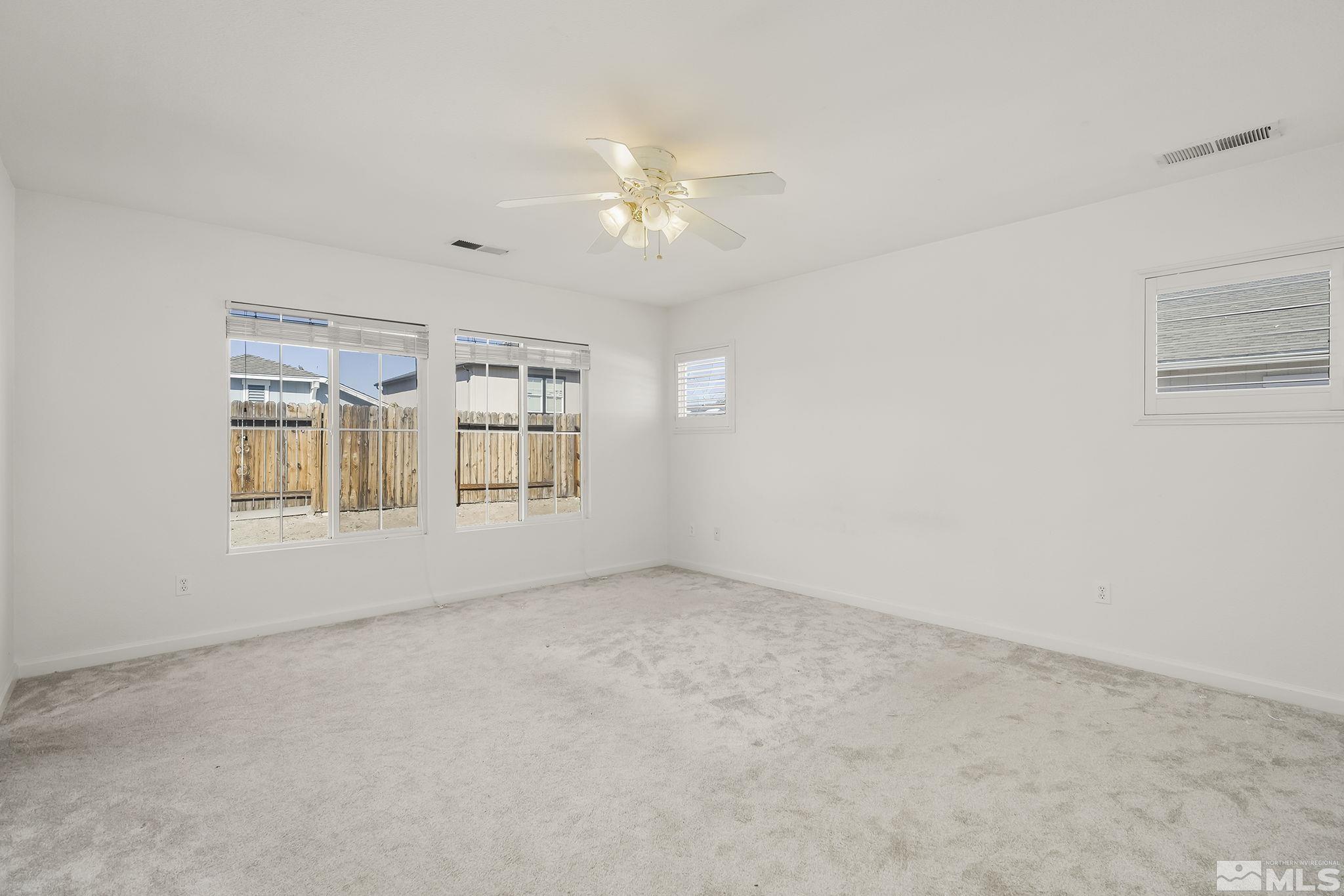 7859 Tulear Street Reno, NV 89506 - Photo 11 of 19 a view of an empty room with a window