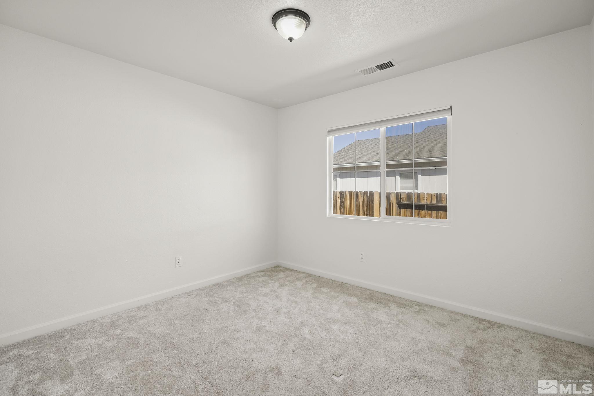 7859 Tulear Street Reno, NV 89506 - Photo 15 of 19 an empty room with windows