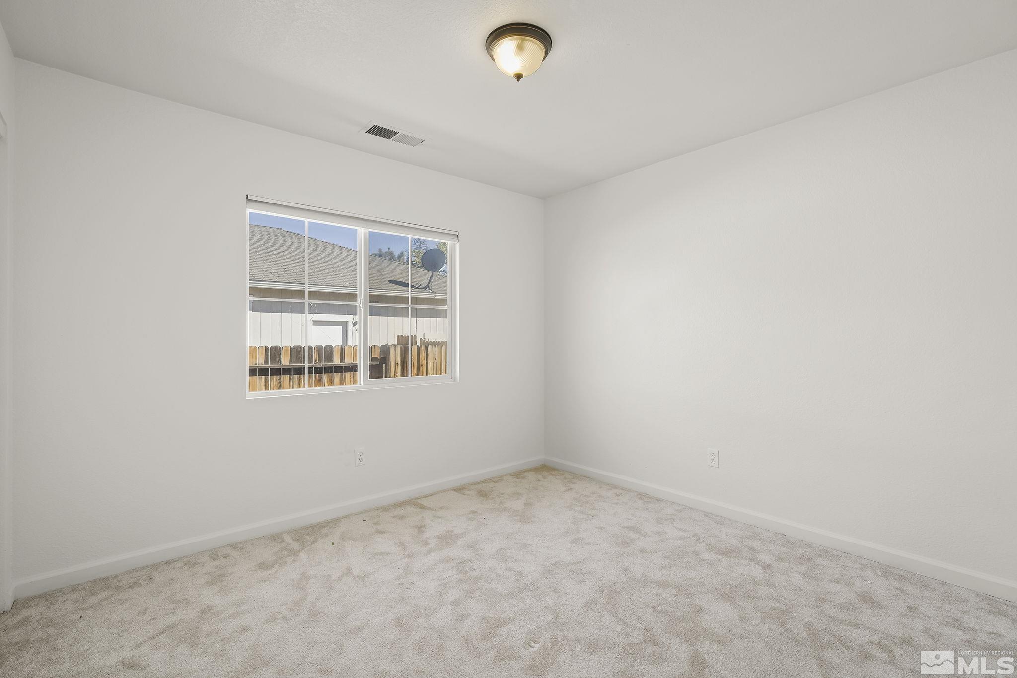7859 Tulear Street Reno, NV 89506 - Photo 16 of 19 an empty room with a window
