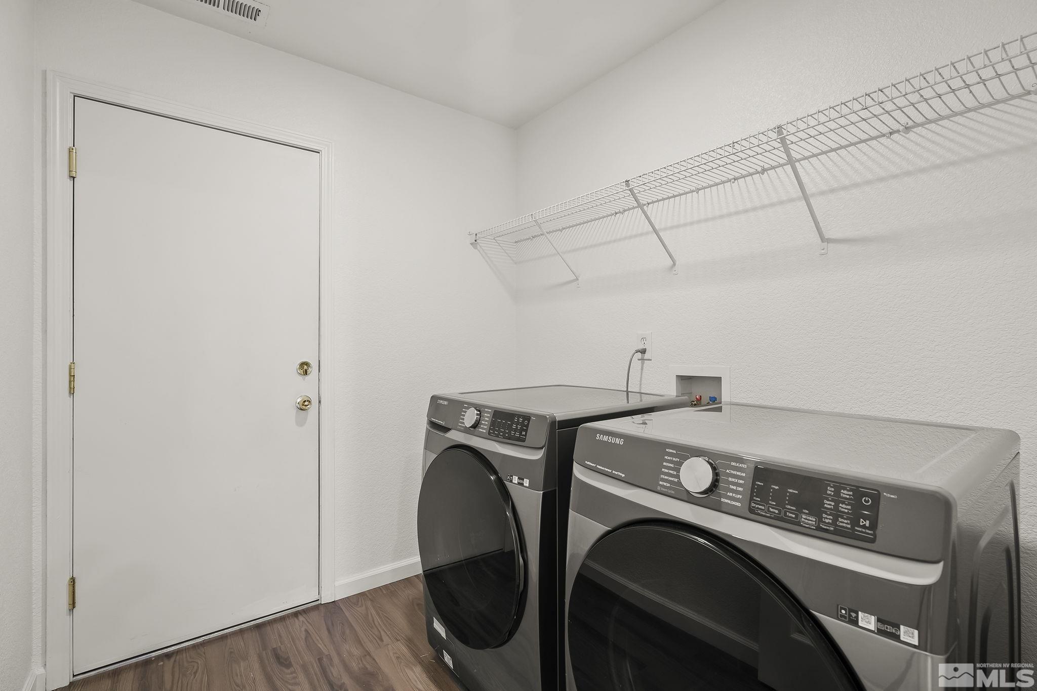 7859 Tulear Street Reno, NV 89506 - Photo 18 of 19 a utility room with dryer and washer