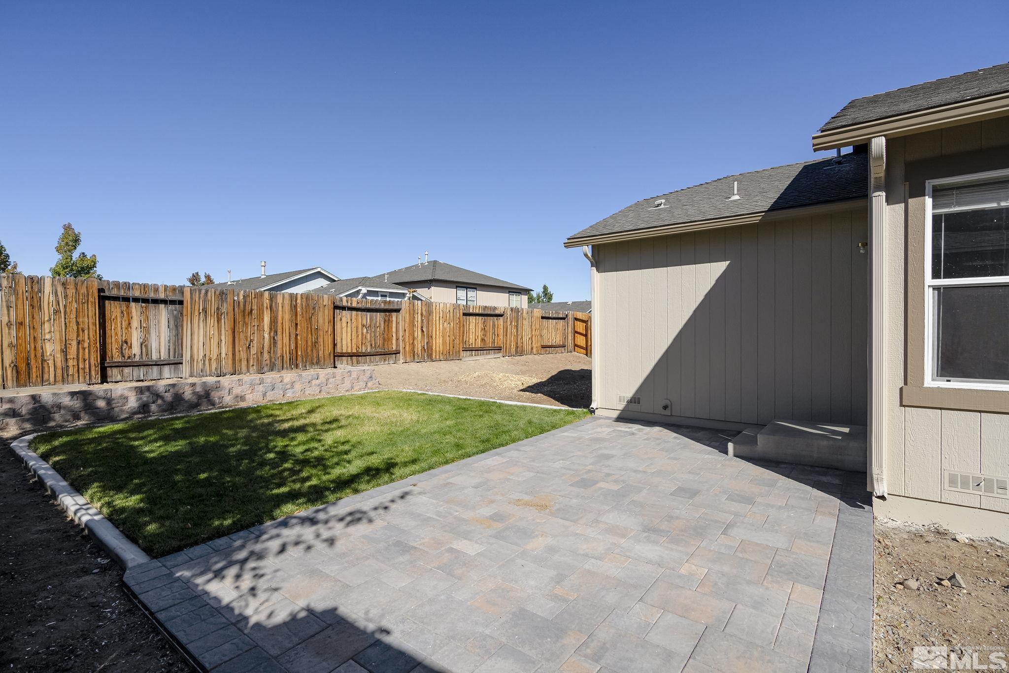 7859 Tulear Street Reno, NV 89506 - Photo 19 of 19 a front view of a house with garden