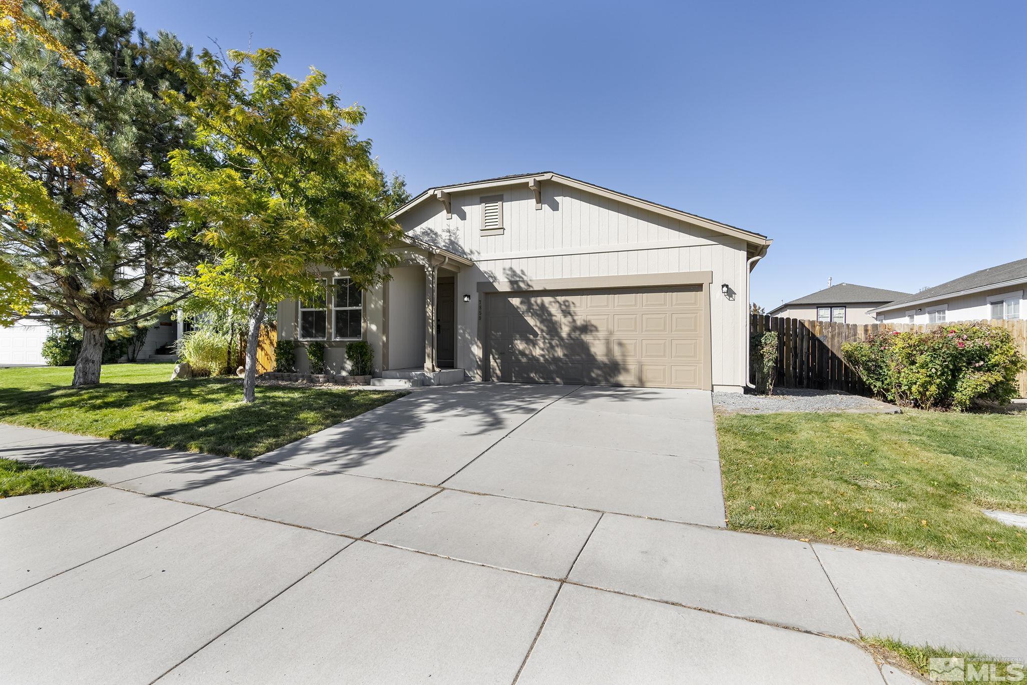 7859 Tulear Street Reno, NV 89506 - Photo 2 of 19 a view of a green house with a yard