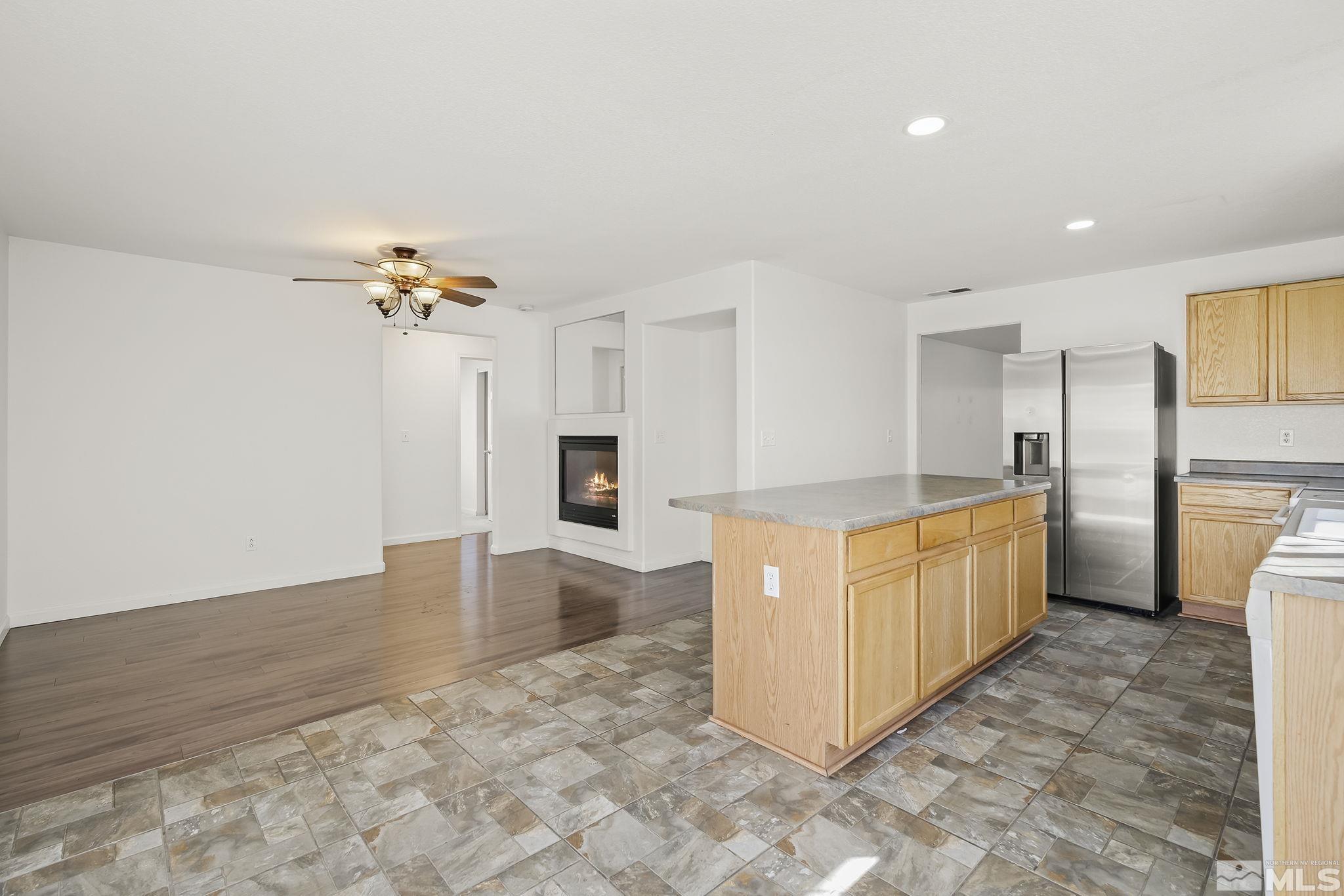 7859 Tulear Street Reno, NV 89506 - Photo 10 of 19 a large white kitchen with cabinets