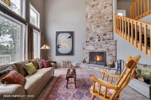 a kitchen with stainless steel appliances granite countertop a sink a refrigerator and cabinets
