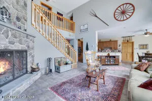 a living room with furniture and a painting