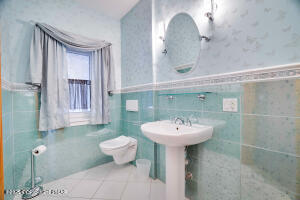 17 Cricket Hill Road Hawley, PA 18428 - Photo 29 of 93 a bathroom with a sink mirror and toilet