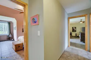 a bedroom with furniture and a flat screen tv