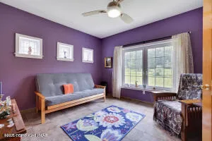 a view of a patio with a table and chairs