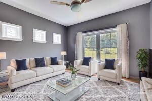 17 Cricket Hill Road Hawley, PA 18428 - Photo 40 of 93 a living room with furniture and a large window
