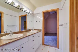 a picture of a bathroom with a shower