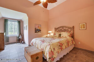 17 Cricket Hill Road Hawley, PA 18428 - Photo 42 of 93 a bedroom with a bed and wooden floor