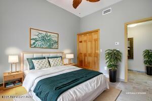 17 Cricket Hill Road Hawley, PA 18428 - Photo 44 of 93 a bedroom with a bed and a potted plant