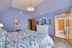 17 Cricket Hill Road Hawley, PA 18428 - Photo 48 of 93 a bedroom with a bed and a view of bathroom