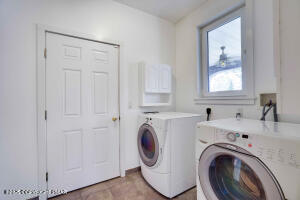 17 Cricket Hill Road Hawley, PA 18428 - Photo 56 of 93 a utility room with sink dryer and washer