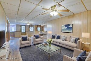 17 Cricket Hill Road Hawley, PA 18428 - Photo 59 of 93 a living room with furniture and a chandelier