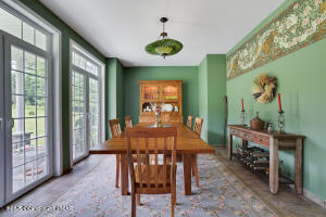 17 Cricket Hill Road Hawley, PA 18428 - Photo 8 of 93 a view of a dining room with furniture window and outside view