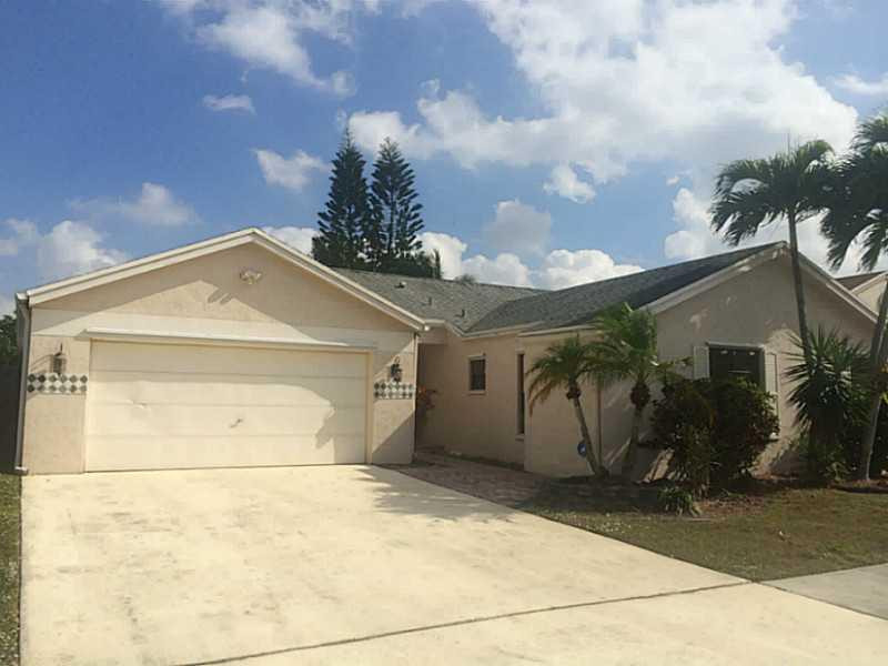 21080 Woodspring Avenue Boca Raton, FL 33428 - Photo 1 of 20 a view of garage